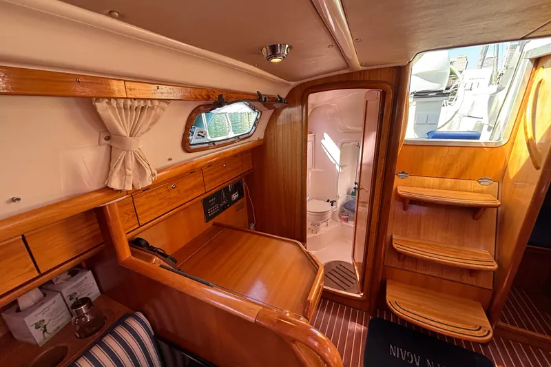Slide: The Image of Interior of 2007 Bavaria Cruiser 33 sailboat with wooden cabinetry and compact bathroom. - 8