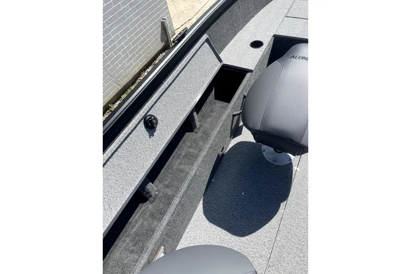 Slide: The Image of 2026 Alumacraft Voyageur 175 Tiller boat interior with open storage compartments. - 5