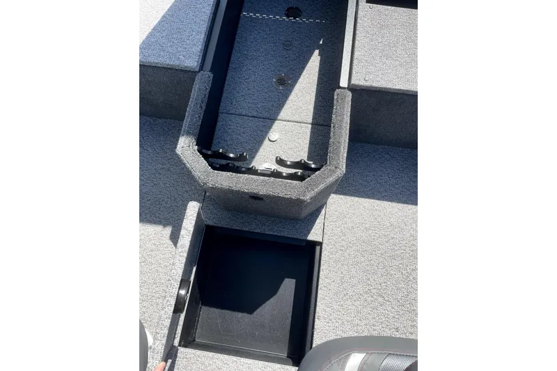 Slide: The Image of 2026 Alumacraft Voyageur 175 Tiller boat interior with storage compartments open. - 7