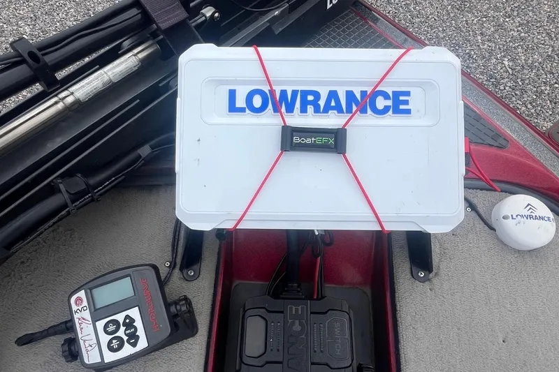 Slide: The Image of 2009 Triton 21X3 Pro DC boat with Lowrance equipment and BoatEFX box on deck. - 13