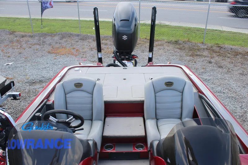 Slide: The Image of 2009 Triton 21X3 Pro DC boat interior with dual seats and steering wheel. - 22