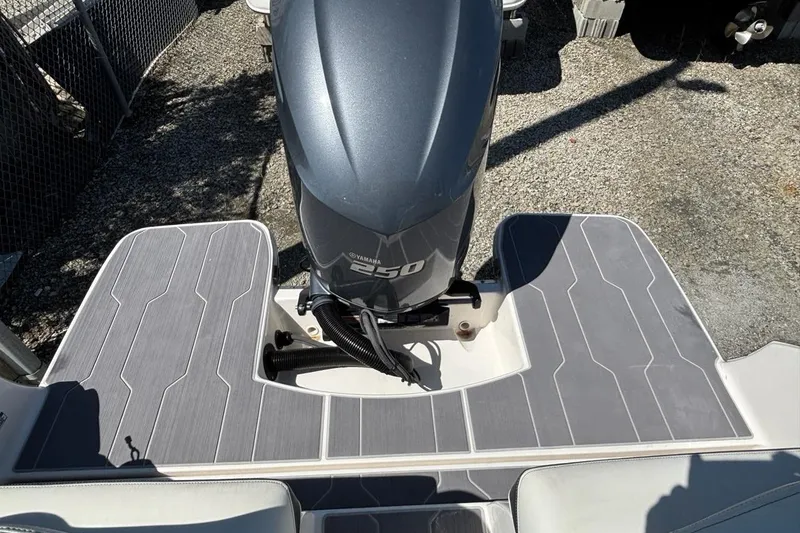 Slide: The Image of 2023 Regal LX4 boat with Yamaha 250 engine on gray deck. - 13
