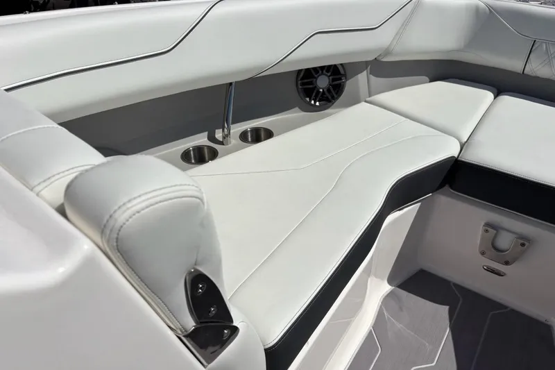 Slide: The Image of Luxurious seating area in 2023 Regal LX4 boat with cup holders and speaker. - 4