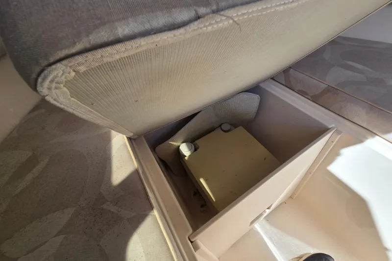 Slide: The Image of Storage compartment under seat in 2004 Grady-White Journey 258 boat interior. - 7