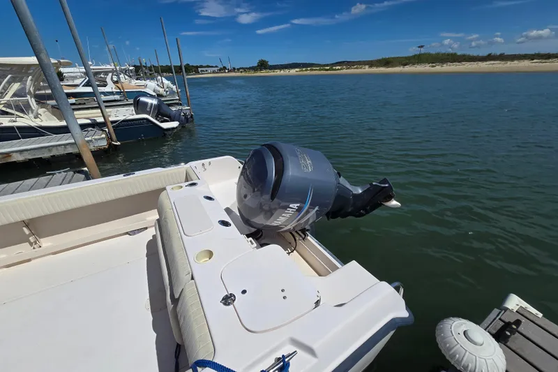 Slide: The Image of 2004 Grady-White Journey 258 boat docked with Yamaha outboard motor. - 9