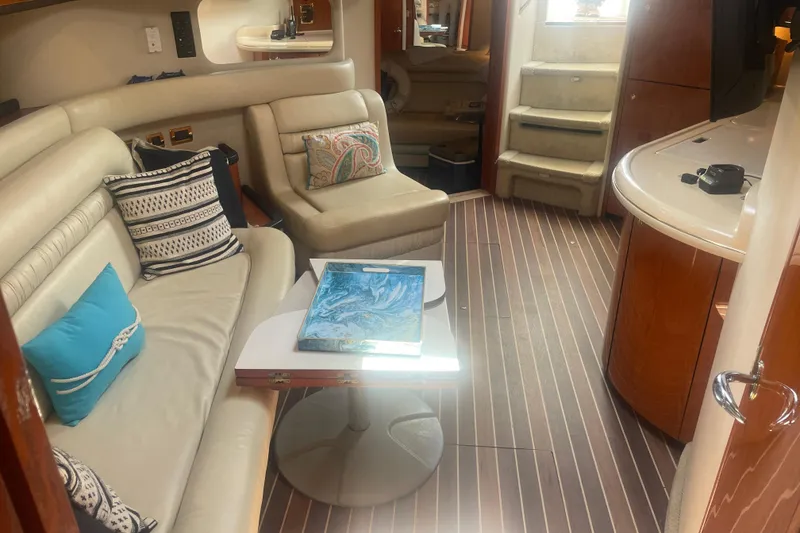 Slide: The Image of Interior of 2001 Sea Ray 460 Sundancer yacht with elegant seating and modern decor. - 10