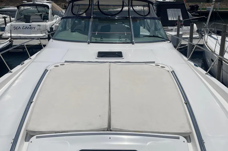 Slide: The Image of 2001 Sea Ray 460 Sundancer yacht with sunpad, docked at marina. - 3