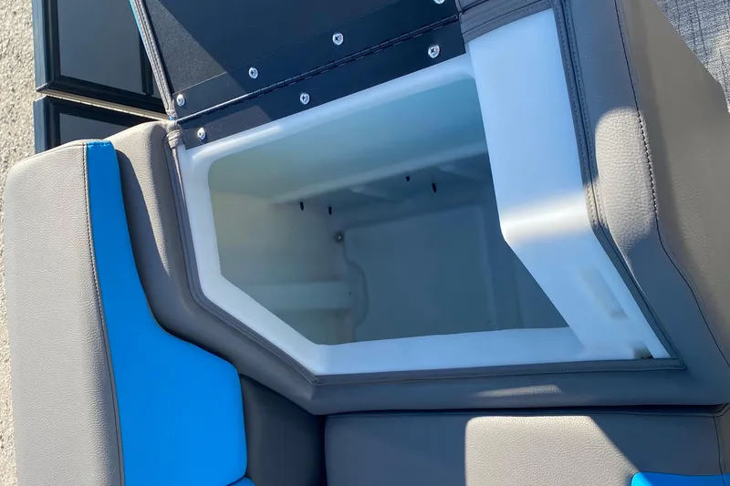 Slide: The Image of 2023 Berkshire 23UL boat seat storage compartment with blue and gray upholstery. - 14