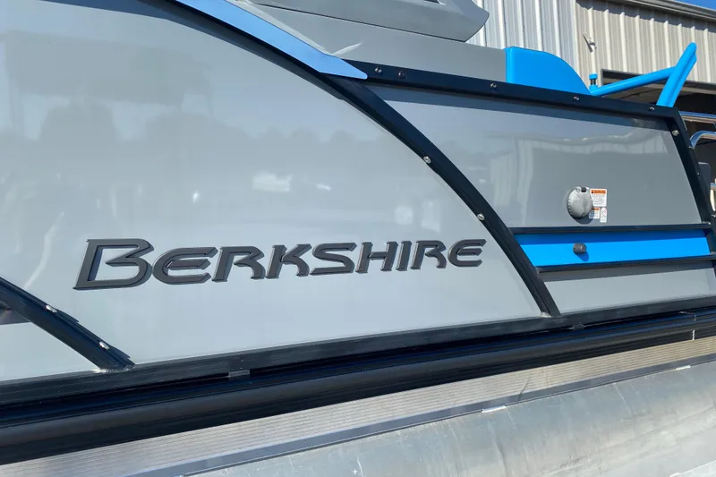 Slide: The Image of 2023 Berkshire 23UL boat exterior with logo and sleek design. - 4