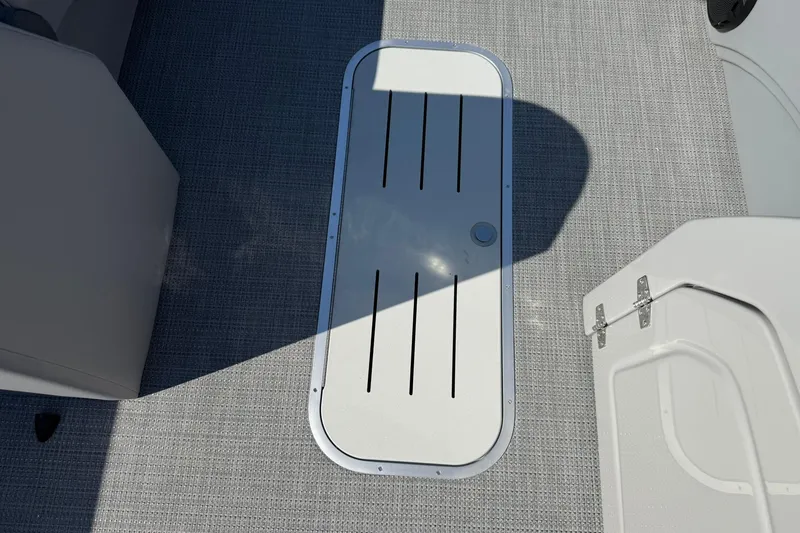 Slide: The Image of 2025 Bentley Pontoons Legacy 243 Swingback deck with storage hatch. - 11
