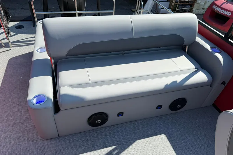 Slide: The Image of 2025 Bentley Pontoons Legacy 243 Swingback interior with gray seating and cup holders. - 13