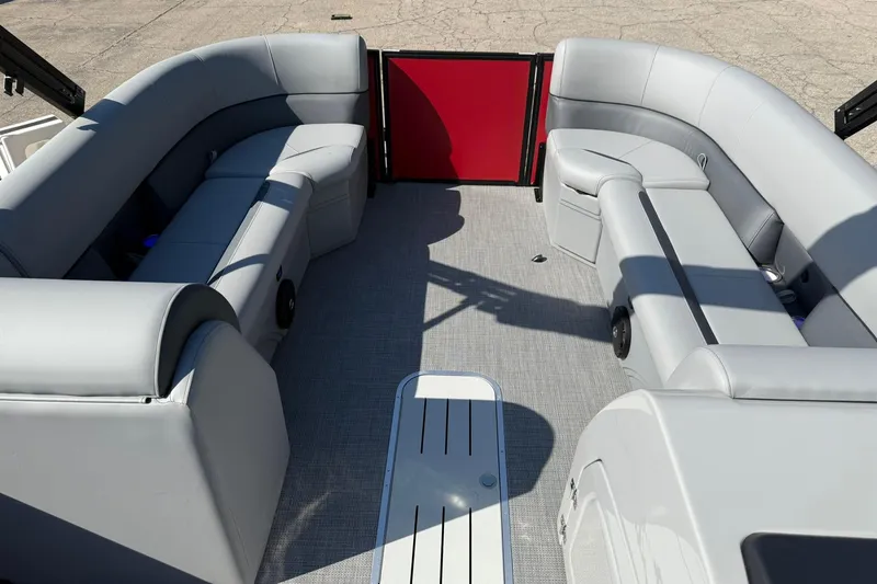Slide: The Image of 2025 Bentley Pontoons Legacy 243 Swingback interior with gray seating and red accent. - 9