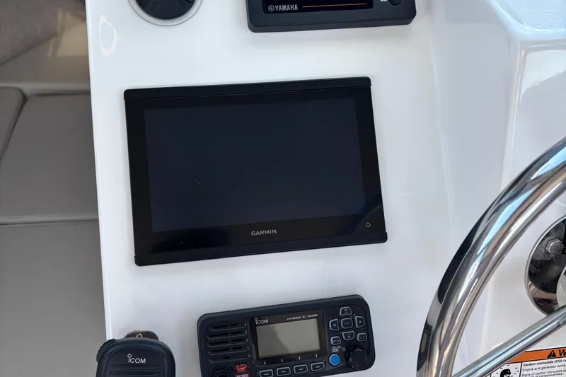 Slide: The Image of Control panel of 2022 Parker 2120 Sport Cabin with Garmin and Icom devices. - 14