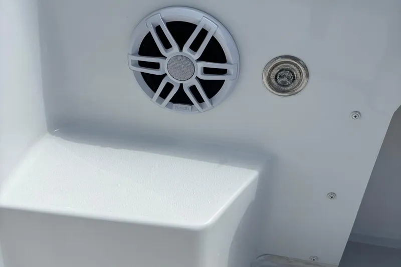 Slide: The Image of Speaker and fixture on 2022 Parker 2120 Sport Cabin boat interior. - 9
