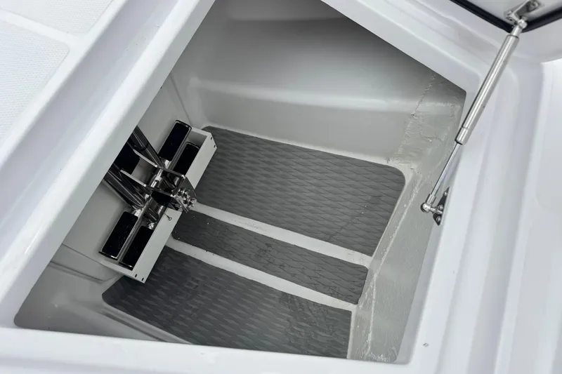 Slide: The Image of 2026 Bertram 34CC storage compartment with hydraulic lift and non-slip flooring. - 14