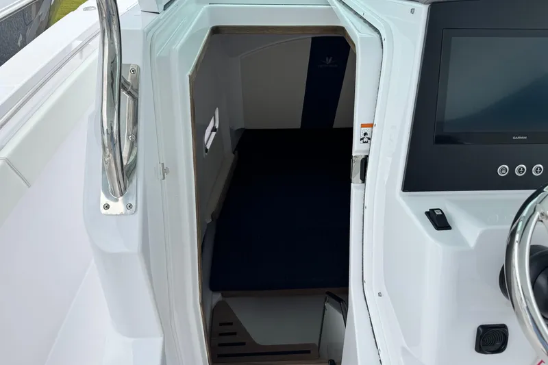 Slide: The Image of 2026 Bertram 34CC cabin interior with modern control panel and sleek design. - 31