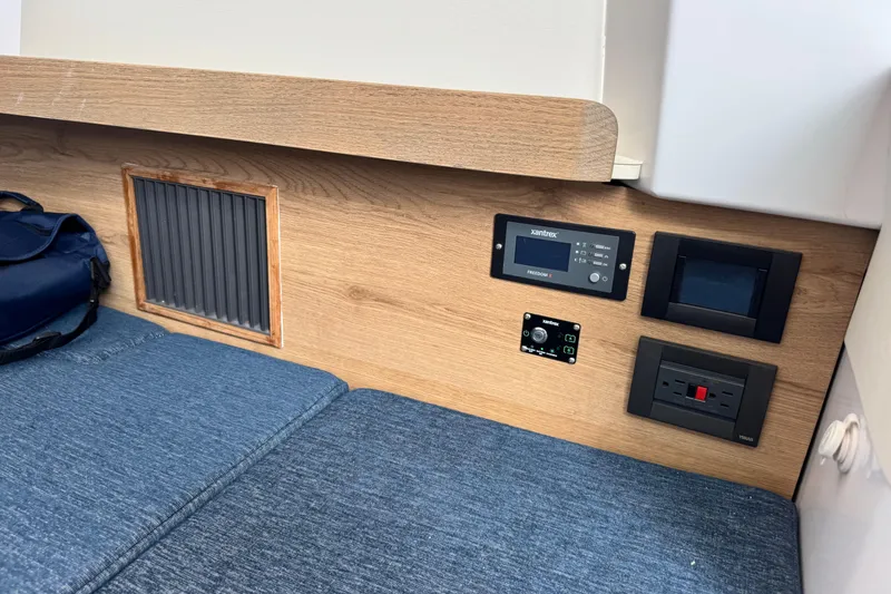 Slide: The Image of Interior of 2026 Bertram 34CC with control panels and blue seating. - 36