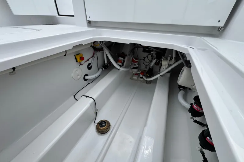 Slide: The Image of Engine compartment of 2026 Bertram 34CC boat, showcasing clean, organized mechanical components. - 49