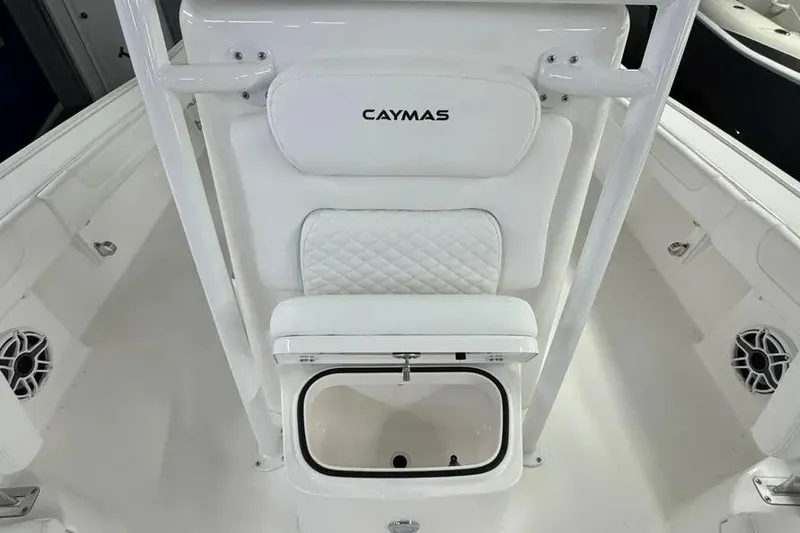 Slide: The Image of 2026 Caymas 281 HB boat interior with white seating and storage compartment. - 16