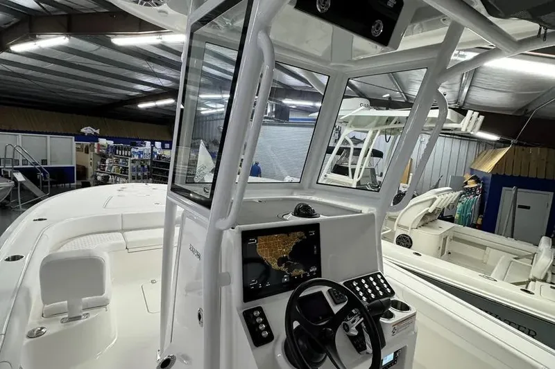 Slide: The Image of 2026 Caymas 281 HB boat interior with navigation system in a showroom. - 17