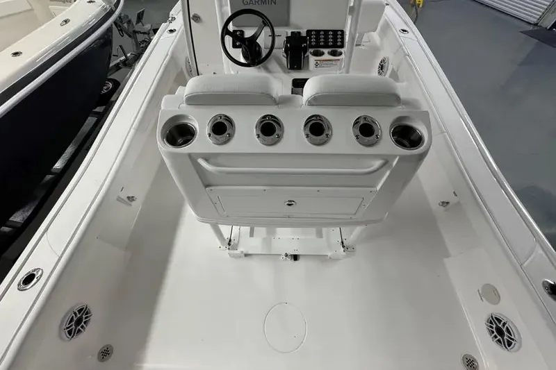 Slide: The Image of 2026 Caymas 281 HB boat interior with steering console and seating. - 4