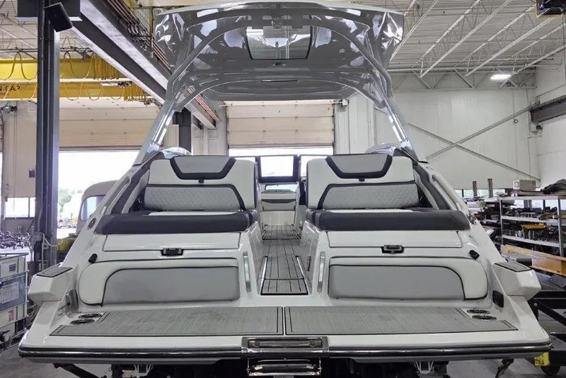 Slide: The Image of 2023 Yamaha Boats 275SDX cockpit with modern dashboard and steering wheel. - 12
