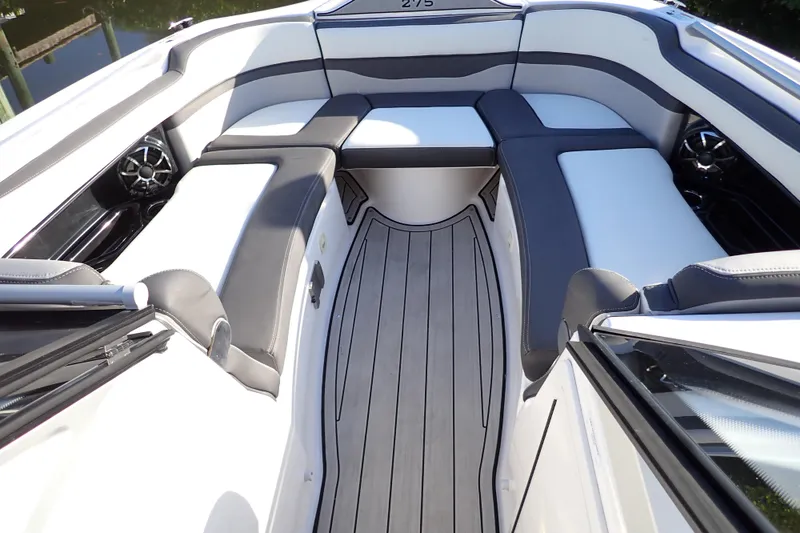 Slide: The Image of 2023 Yamaha Boats 275SDX interior with sleek seating and modern design. - 16