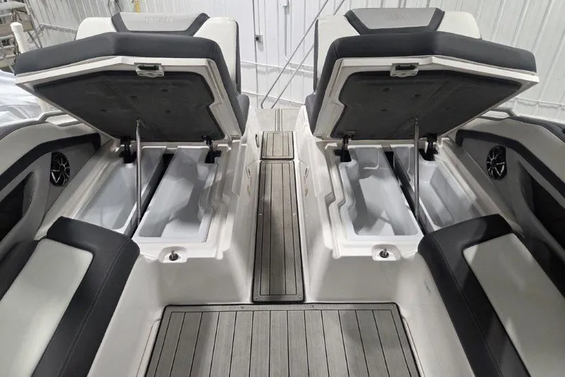 Slide: The Image of 2023 Yamaha Boats 275SDX interior with open storage compartments and sleek seating. - 20