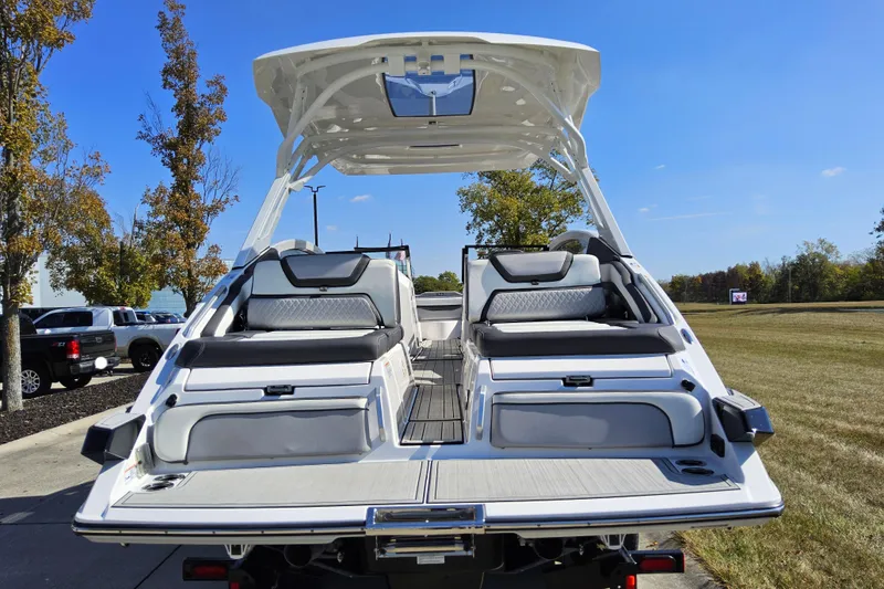 Slide: The Image of 2023 Yamaha Boats 275SDX, rear view, showcasing luxurious seating and sleek design. - 25