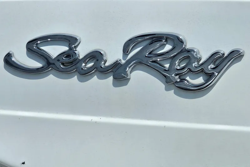 Slide: The Image of Chrome "Sea Ray" logo on a 1989 Sea Ray 280 Sundancer boat. - 23