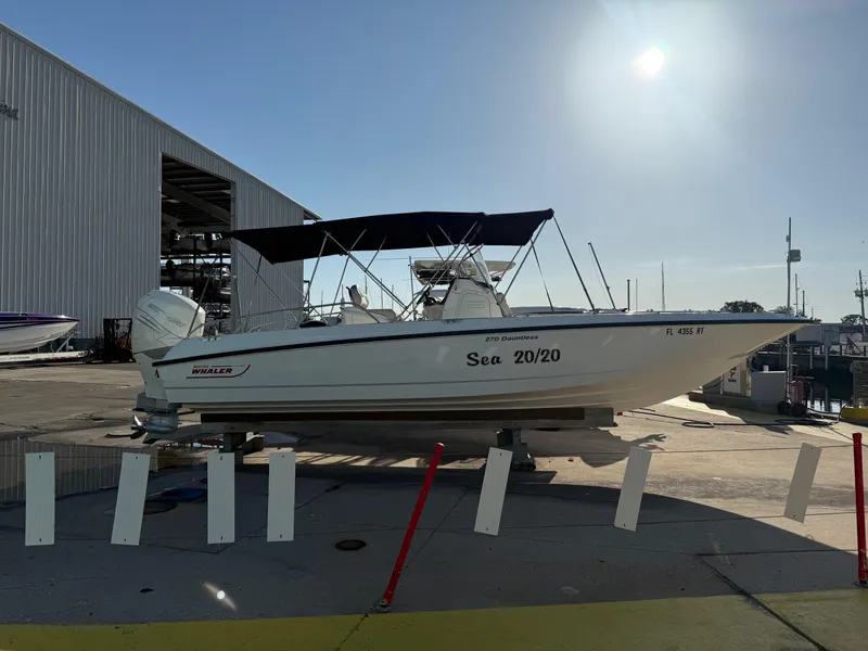 The Image of 2017 Boston Whaler 270 Dauntless boat docked under sunny sky. - 0