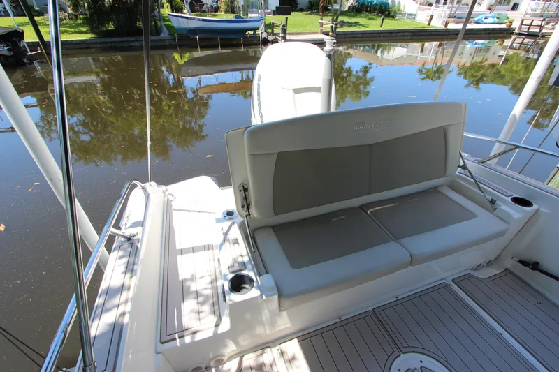Slide: The Image of 2017 Boston Whaler 270 Dauntless boat interior with seating and water view. - 10