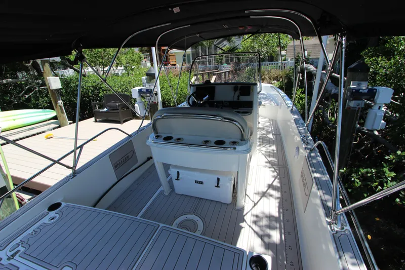 Slide: The Image of 2017 Boston Whaler 270 Dauntless boat interior with seating and console. - 11