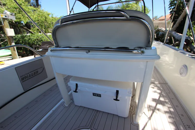 Slide: The Image of 2017 Boston Whaler 270 Dauntless boat interior with Yeti cooler under seat. - 13