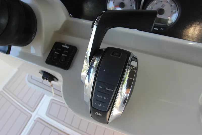 Slide: The Image of Close-up of 2017 Boston Whaler 270 Dauntless throttle control on boat dashboard. - 17