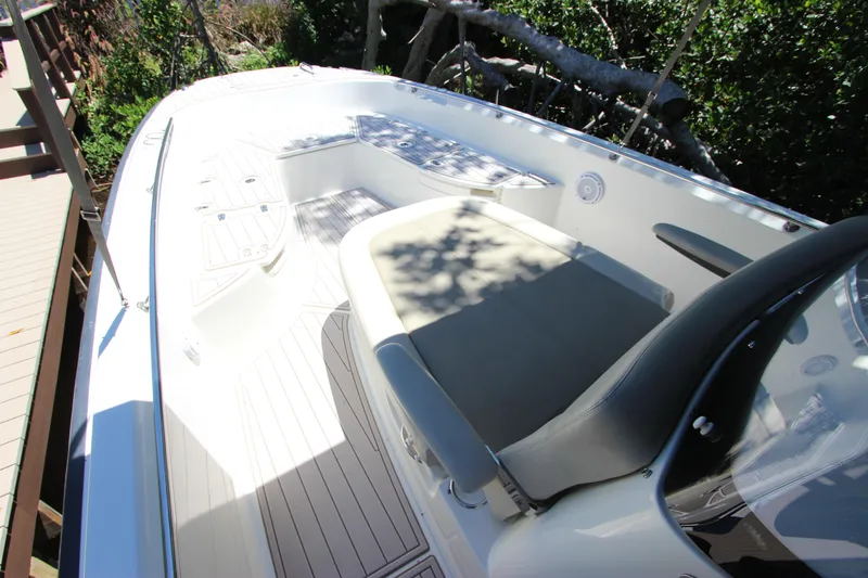 Slide: The Image of 2017 Boston Whaler 270 Dauntless boat interior with seating and deck view. - 25