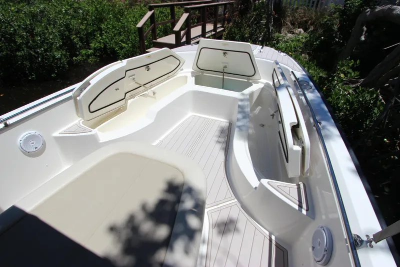 Slide: The Image of 2017 Boston Whaler 270 Dauntless boat interior with seating and storage compartments. - 27