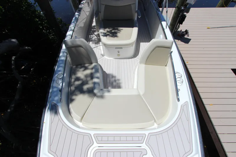 Slide: The Image of 2017 Boston Whaler 270 Dauntless boat interior with cushioned seating and sleek design. - 30