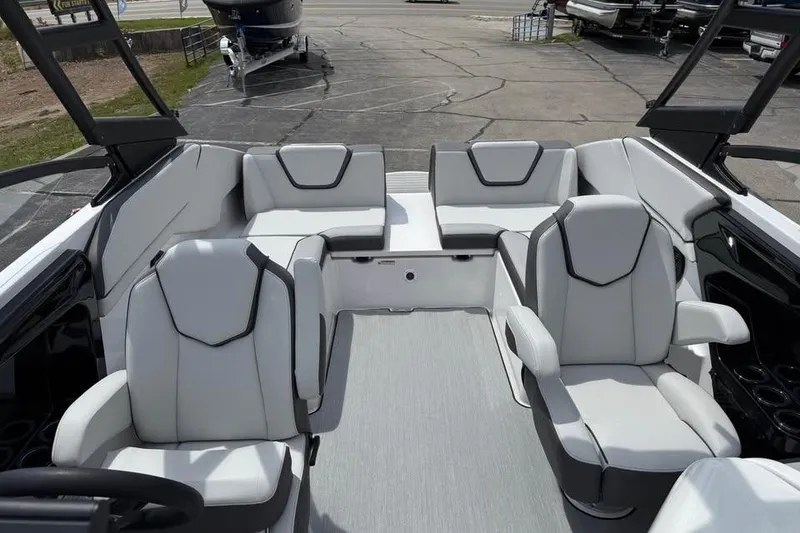 Slide: The Image of 2026 Yamaha Boats AR250 interior with modern seating and sleek design. - 12