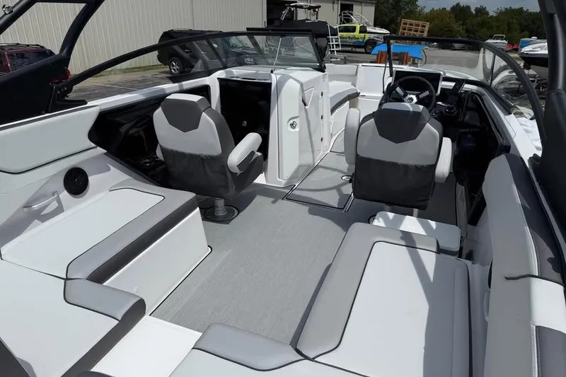 Slide: The Image of 2026 Yamaha Boats AR250 interior with modern seating and sleek design. - 7