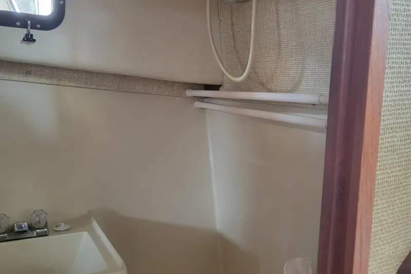 Slide: The Image of Interior of 1981 Bayliner 3270 Explorer boat bathroom with sink and shower. - 21