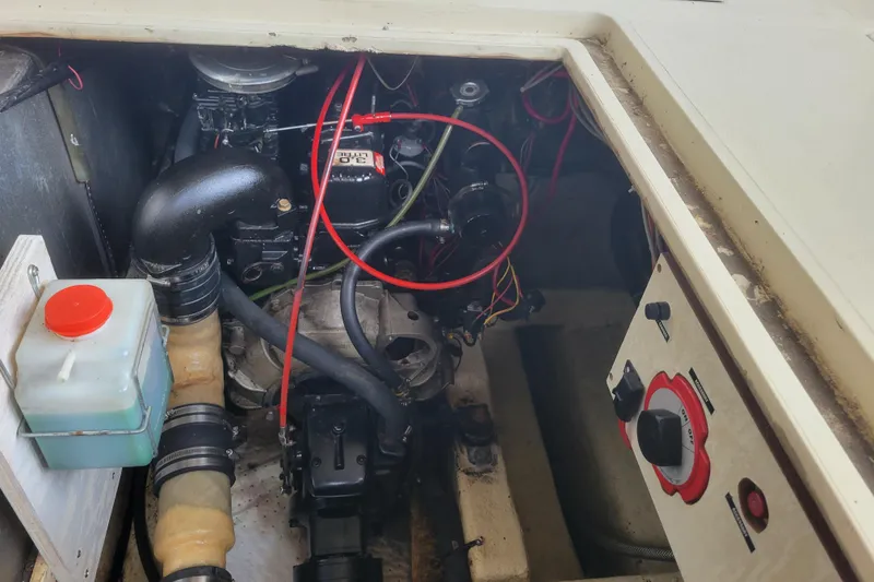 Slide: The Image of Engine compartment of a 1981 Bayliner 3270 Explorer boat, showing mechanical components and wiring. - 25