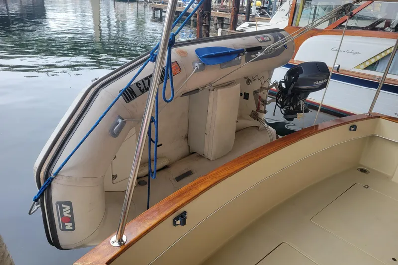 Slide: The Image of 1981 Bayliner 3270 Explorer with inflatable dinghy and Yamaha outboard motor. - 4