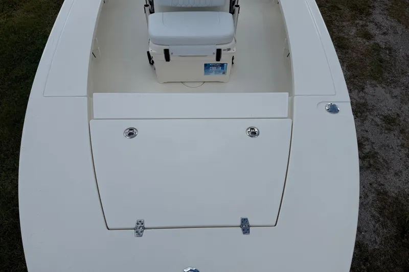 Slide: The Image of 2026 Hewes 16 Redfisher boat deck with seating and storage compartments. - 17