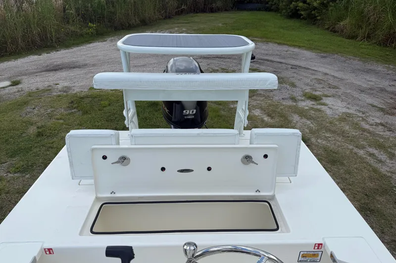 Slide: The Image of 2026 Hewes 16 Redfisher boat with Yamaha 90 engine, rear view. - 22