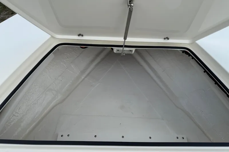 Slide: The Image of Open storage compartment of 2026 Hewes 16 Redfisher boat, showcasing interior space. - 31