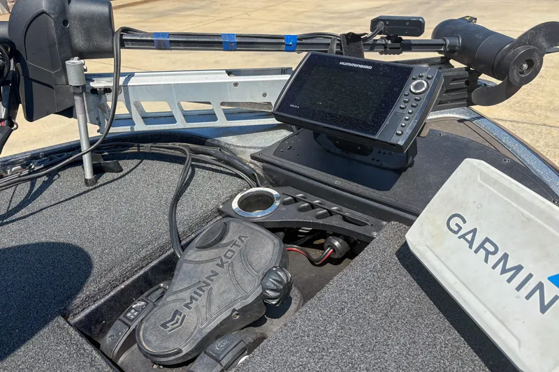 Slide: The Image of Boat dashboard with Humminbird fishfinder, Minn Kota pedal, and Garmin equipment on Nitro Z19, 2021. - 10