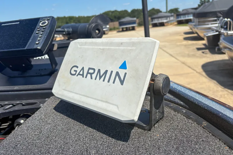 Slide: The Image of Garmin device on 2021 Nitro Z19 boat, with Humminbird equipment in the background. - 11