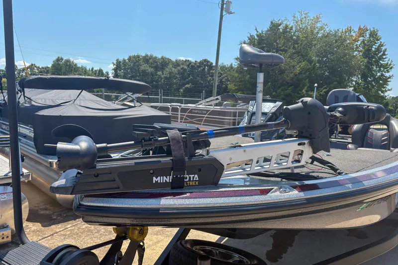 Slide: The Image of 2021 Nitro Z19 boat with Minn Kota Ultrex trolling motor, parked outdoors. - 5