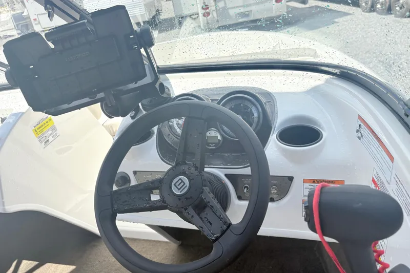 Slide: The Image of 2020 Bayliner 170 Bowrider dashboard with steering wheel and control panel. - 11